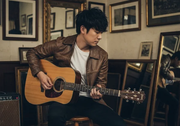 Beginner violinist with instrument and digital tuner screen