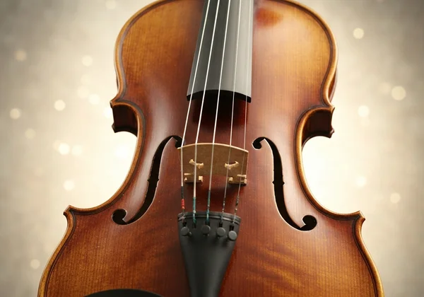 Violin with G, D, A, E strings labeled, thickest to thinnest